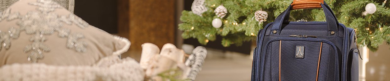 Travelpro underseat carry on suitcase under Christmas tree