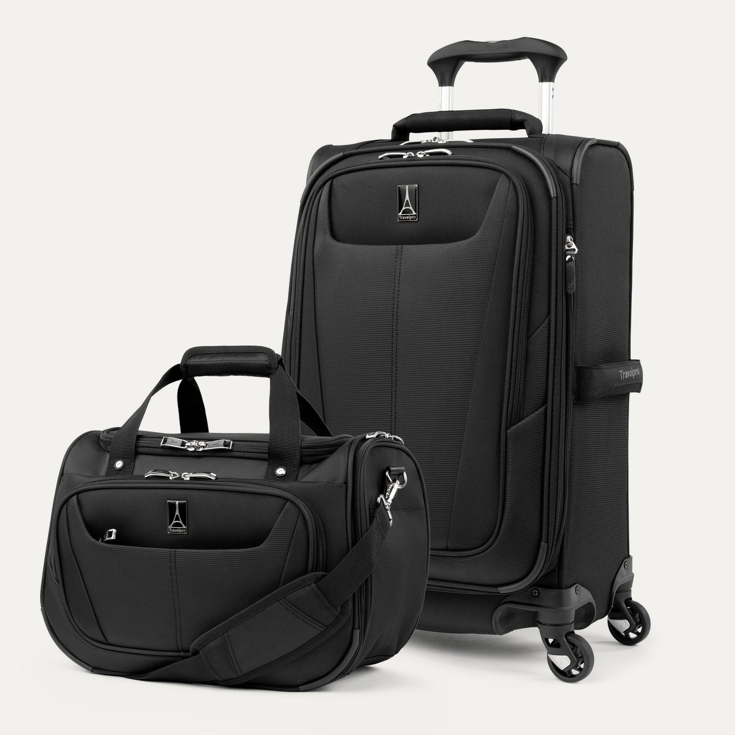 Black suitcase and tote set on a white background