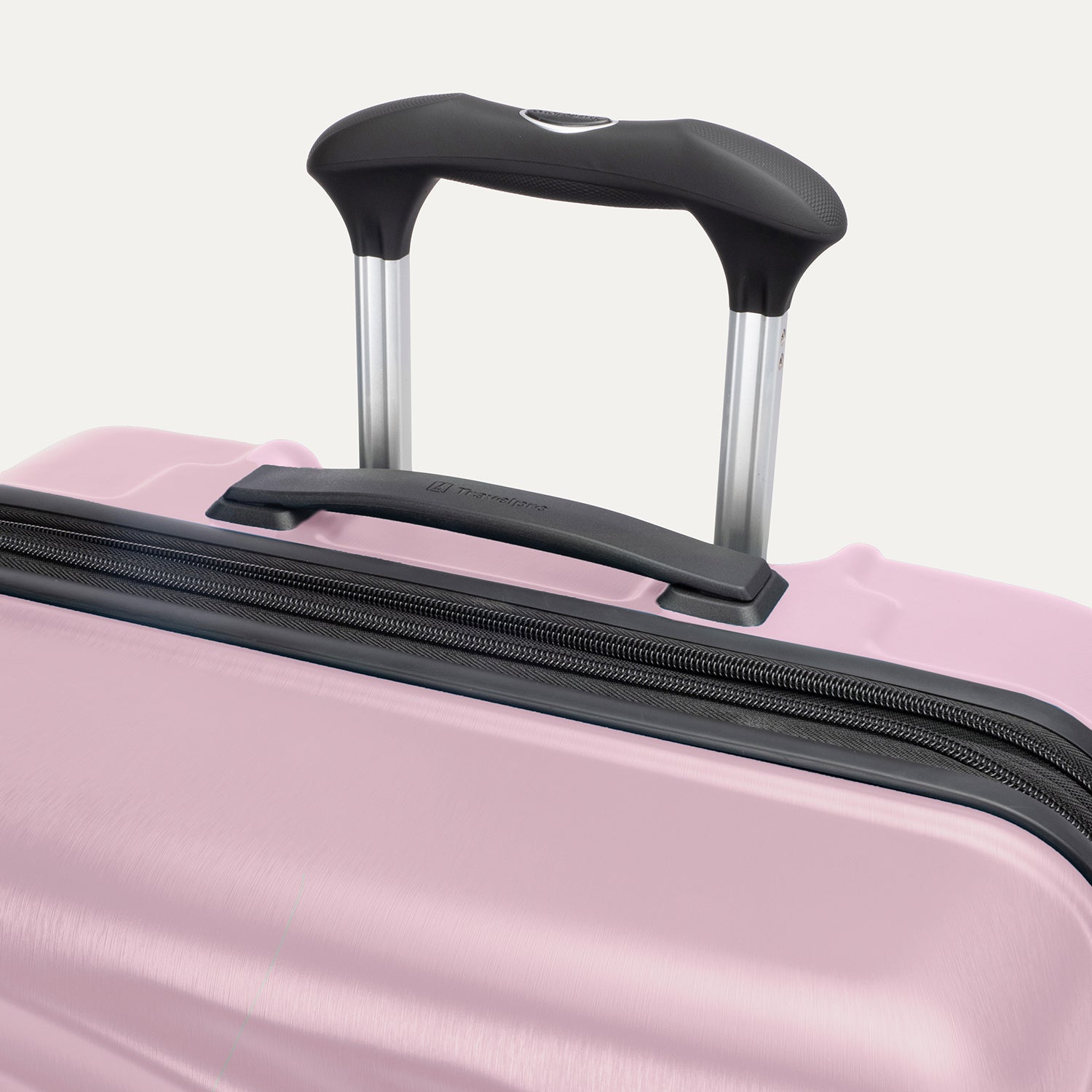Top view of Travelpro Maxlite Air V2 Check-In Spinner in Orchid Pink, featuring the Contour Grip and PowerScope Lite Handle.