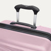 Top view of Travelpro Maxlite Air V2 Check-In Spinner in Orchid Pink, featuring the Contour Grip and PowerScope Lite Handle.