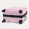 Bottom view of Travelpro Maxlite Air V2 Spinner in Orchid Pink, featuring dual spinner wheels and visible side carry handle.