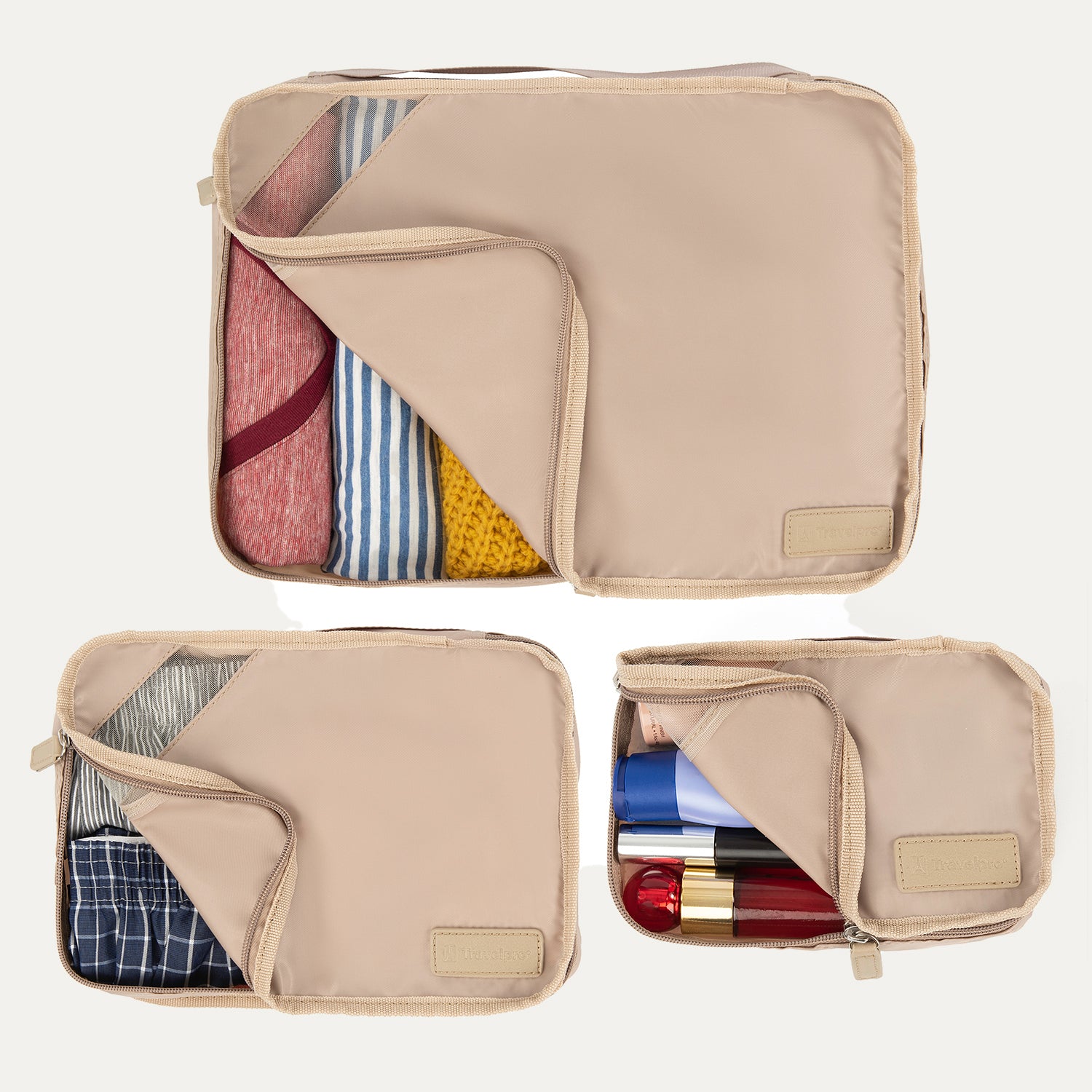 Top view of Travelpro Essentials 3 Pack Packing Cube Set (S/M/L) in KHAKI, partially open to reveal organized contents.