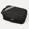 A black Travelpro Essentials medium expandable/compressible packing cube with a silver zipper.