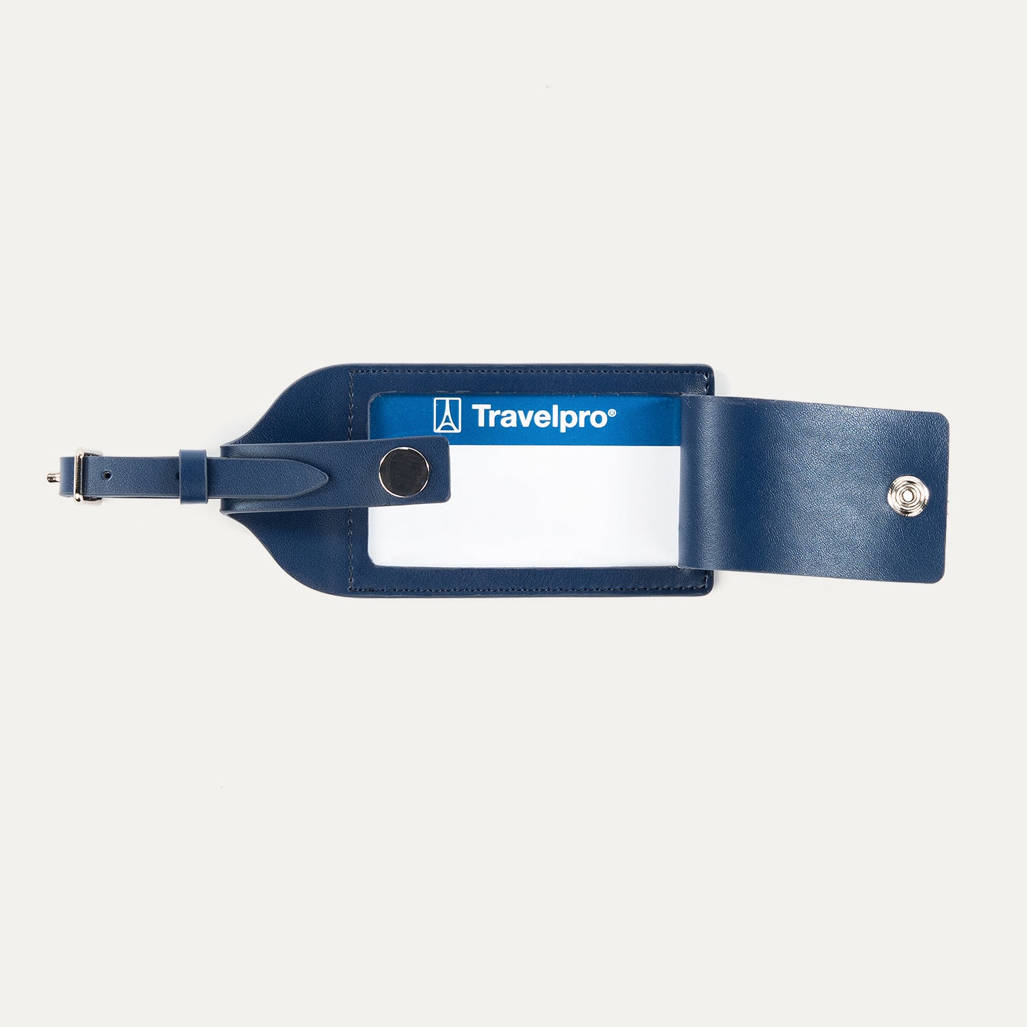 Open view of Travelpro Essentials Leather Luggage Tag in Navy, revealing ID window and snap-closure privacy flap.