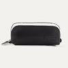 A black Travelpro Essentials MaxAccess Cubes small organizer with a zipper, made from high-density polyester fabric, with a built-in side pocket for storing smaller items.