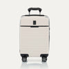 Front view of T+L Compact Carry-On Spinner in White Sand, shown with grooved shell and four 360° Spinner Wheels.