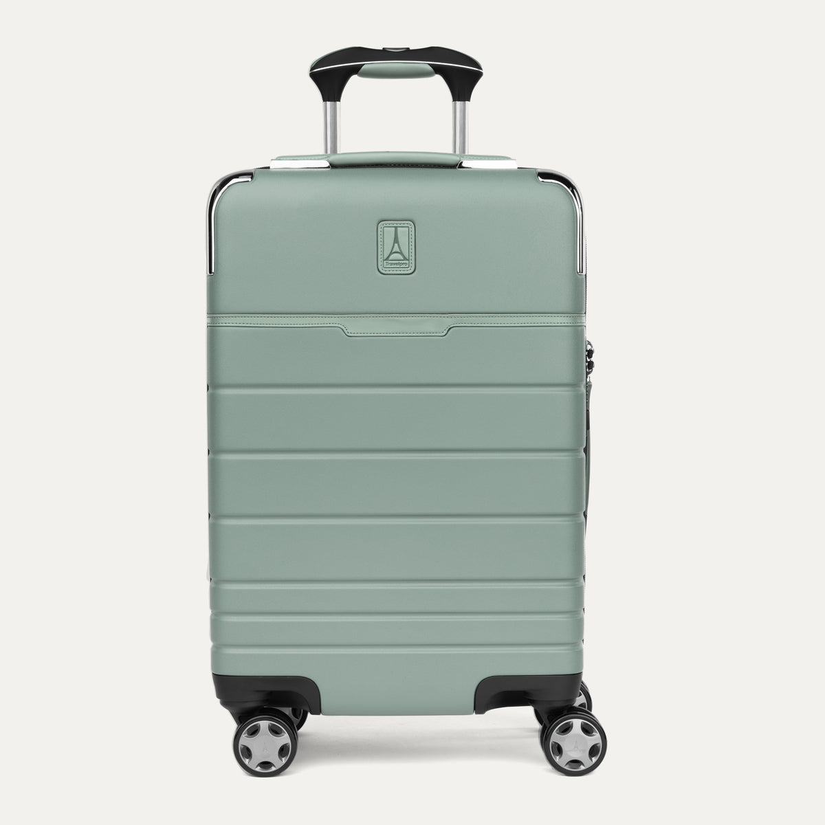 Front view of T+L Carry-On Spinner in Center Sage Green, showing a smooth shell with horizontal grooves and black wheels