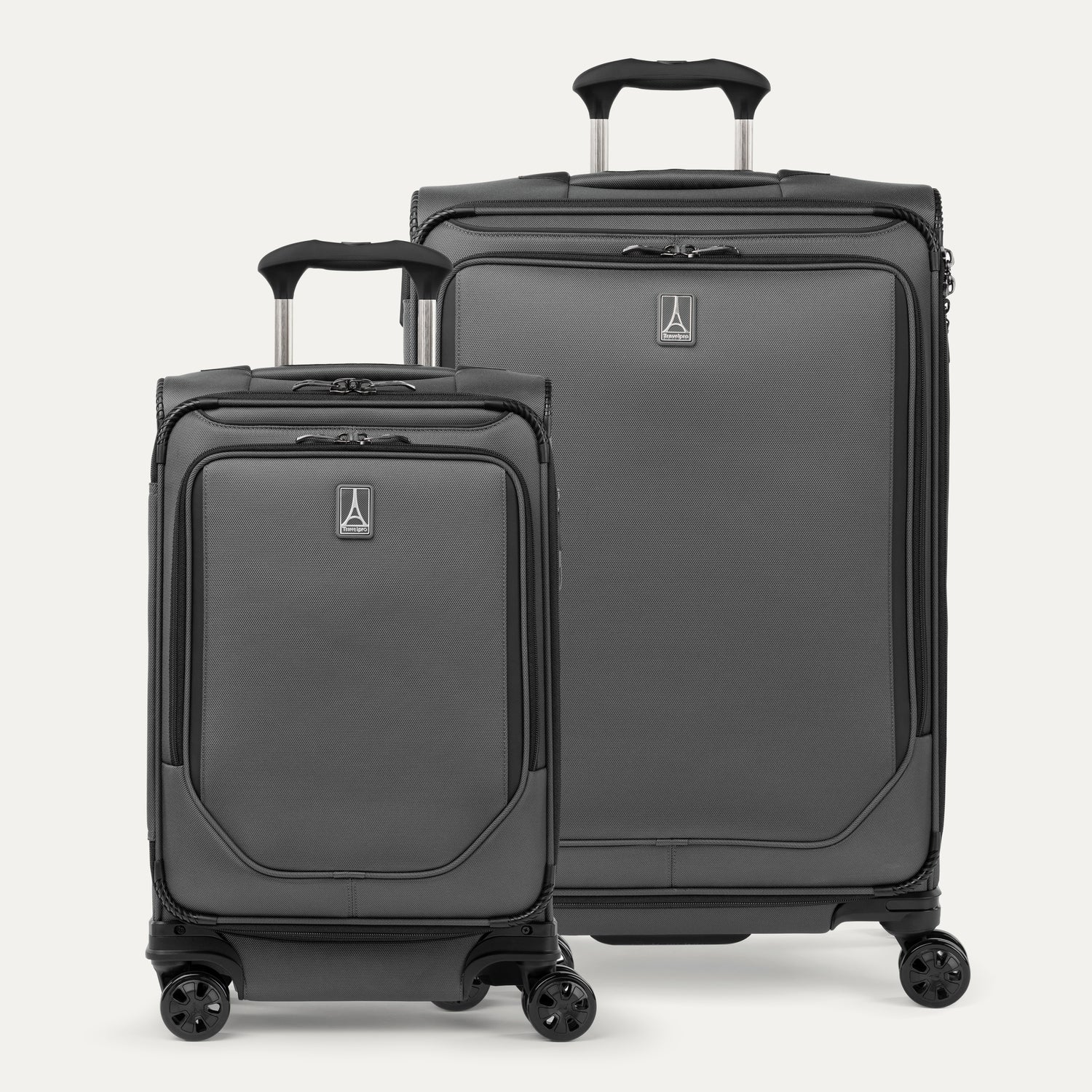 A set of two gray travel spinner suitcases, one carry-on size and one medium check-in size, with the travelpro logo visible on the front.