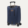 Rear view of a Travelpro Crew Classic Spinner in Patriot Blue, showing dual spinner wheels and protective corner guards.