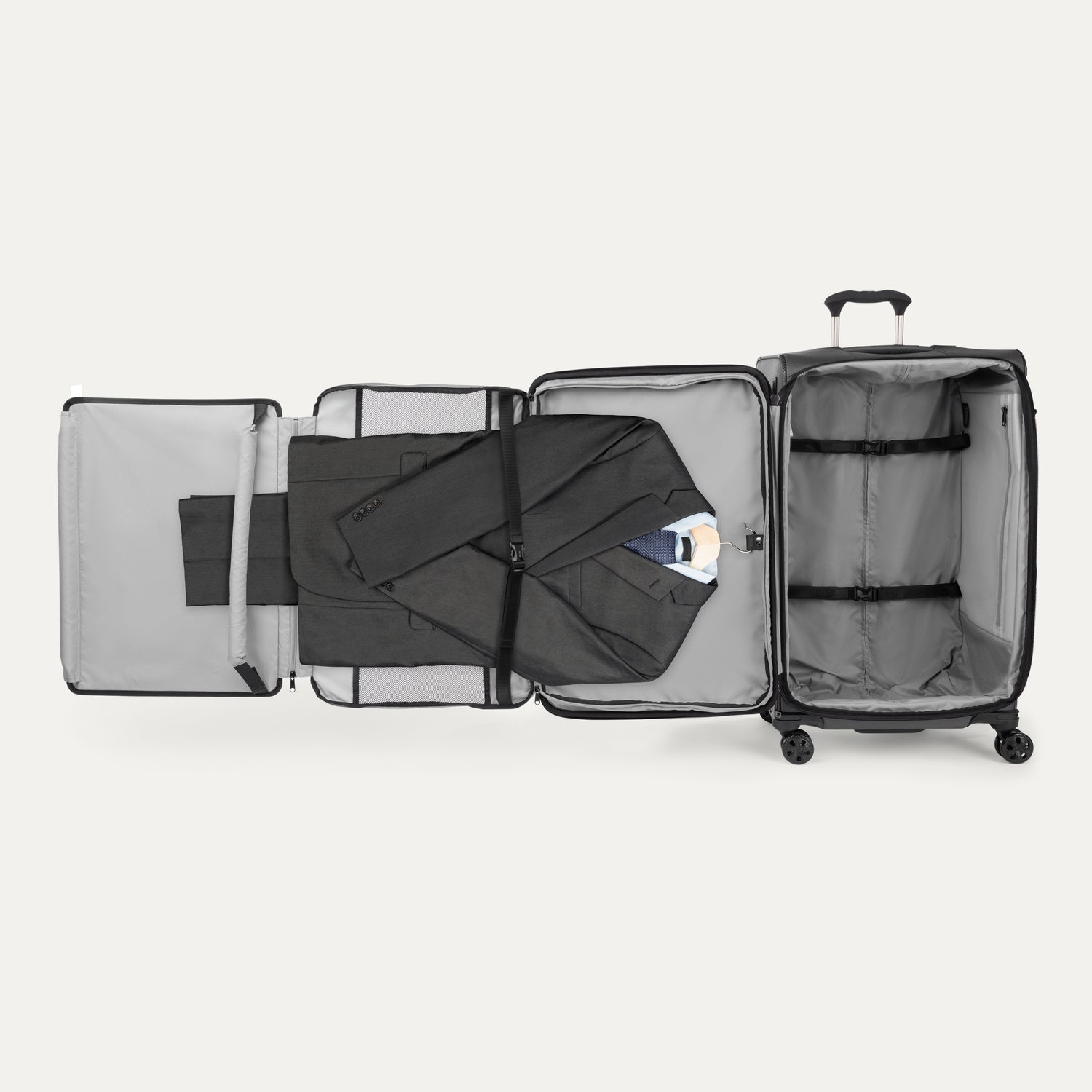 Interior view of the Travelpro Crew Classic Spinner in Black, featuring a Suiter Packing System.