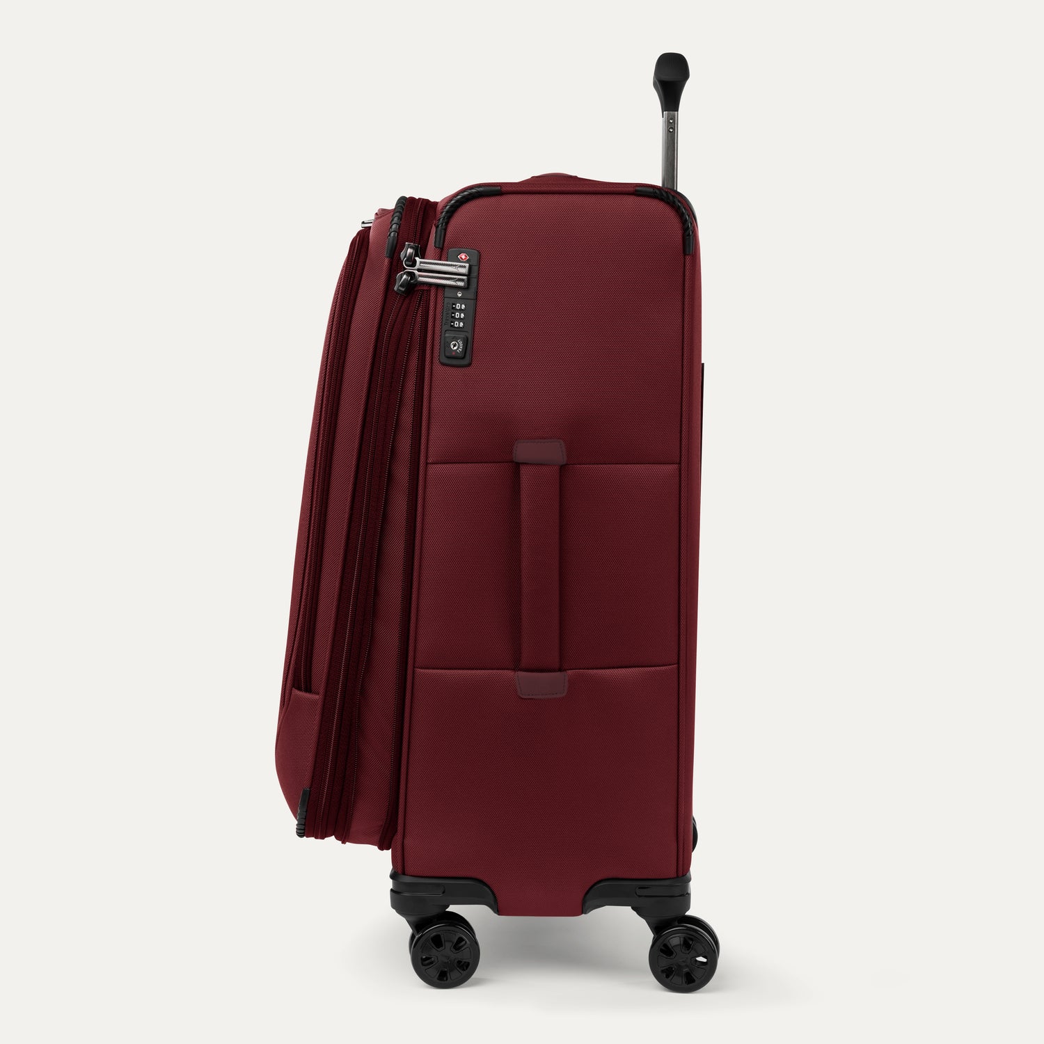 Side view of red suitcase with handle and wheels on a white a background