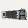 Open suitcase with fold out suiter and clothes on a white background