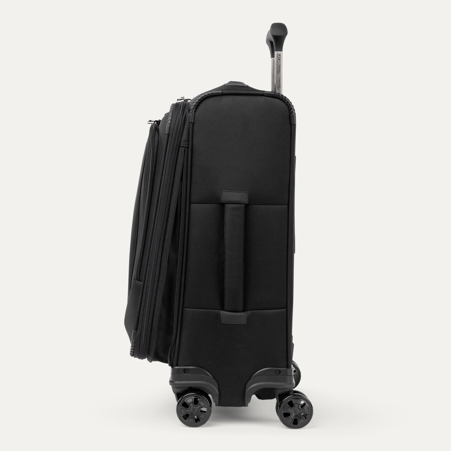 Side view of black suitcase with handle and wheels on a white a background
