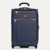 Front view of Travelpro Platinum Elite Carry-On Rollaboard in True Navy, featuring dual front zip pockets, leather accent trim, side carry handle, and telescoping handle.