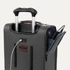 Close-up of a gray suitcase with handle and USB cable on a white background