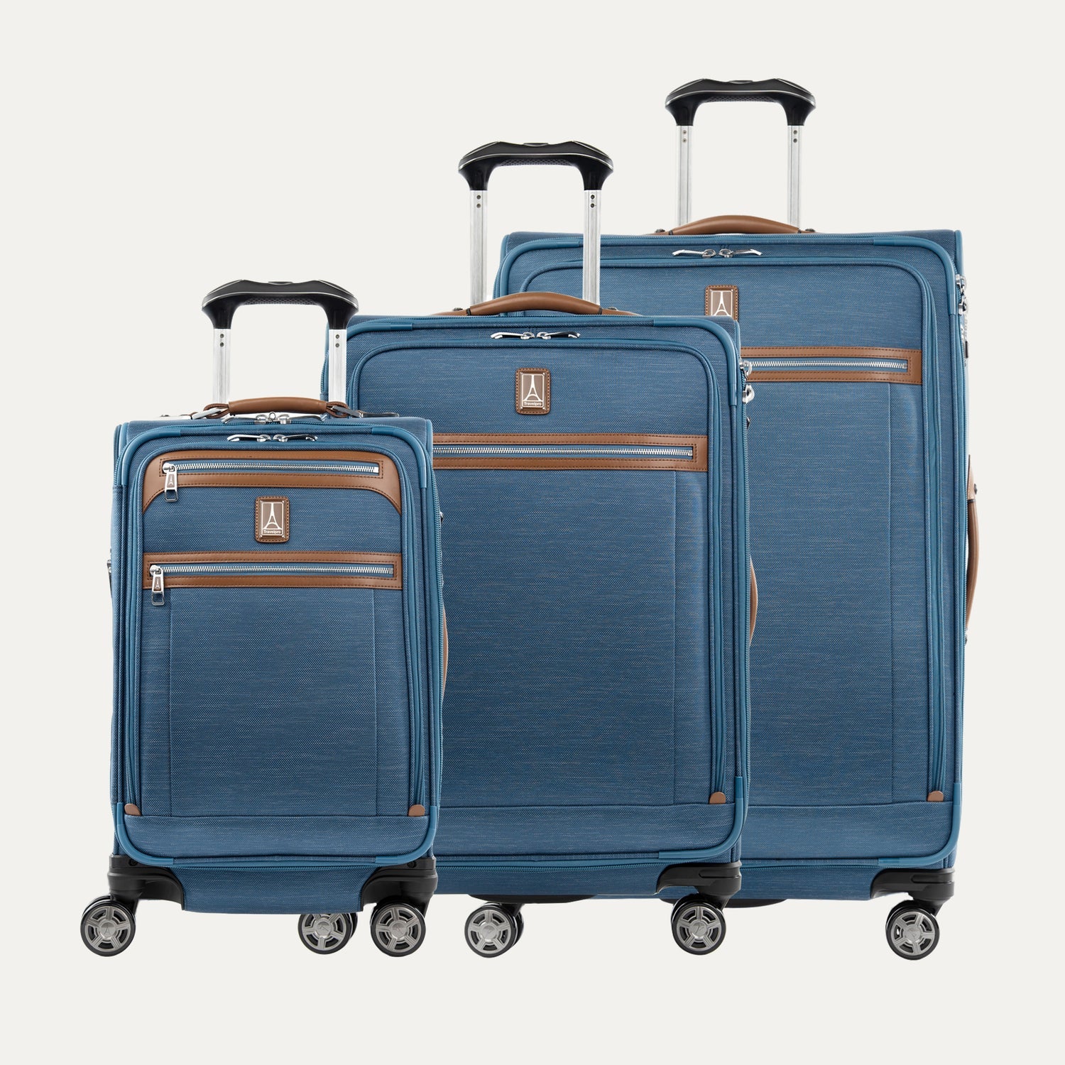 A set of three blue Platinum Elite spinner luggage bags, including a carry-on size and two larger sizes on a white background