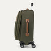 Side view of green suitcase with wheels and handle on a white background