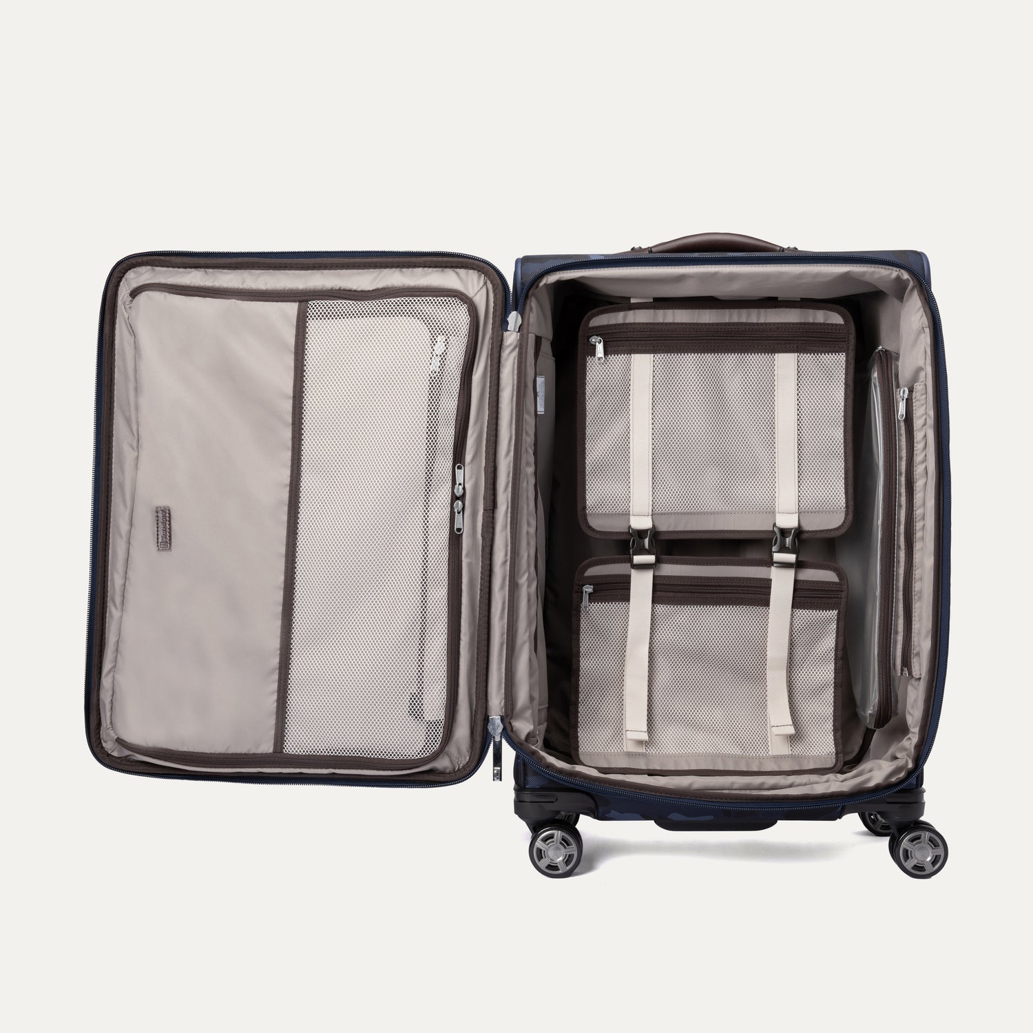 Open Platinum® Elite Medium Check-In Spinner in Camouflage, showing interior with fold-out suiter and mesh zippered compartments for organized packing.