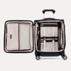 Open view of Travelpro® Platinum® Elite International Carry-On Spinner in True Navy, showing interior mesh pockets and hold-down straps.