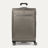 Front-facing Travelpro Platinum Elite Large Expandable Spinner in Metallic Sand, with silver zipper accents and 360° spinner wheels.