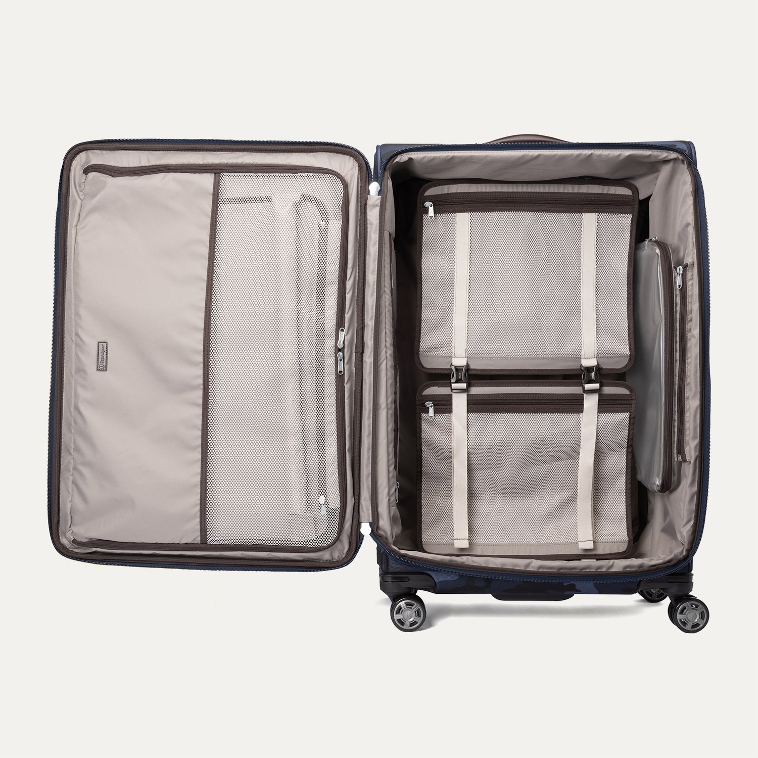 Open Platinum® Elite Large Check-In Spinner in Camouflage displaying organized interior with mesh pockets, packing cubes, and zippered compartments.