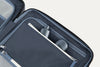 Close-up of a open suitcase interior with toiletries inside.