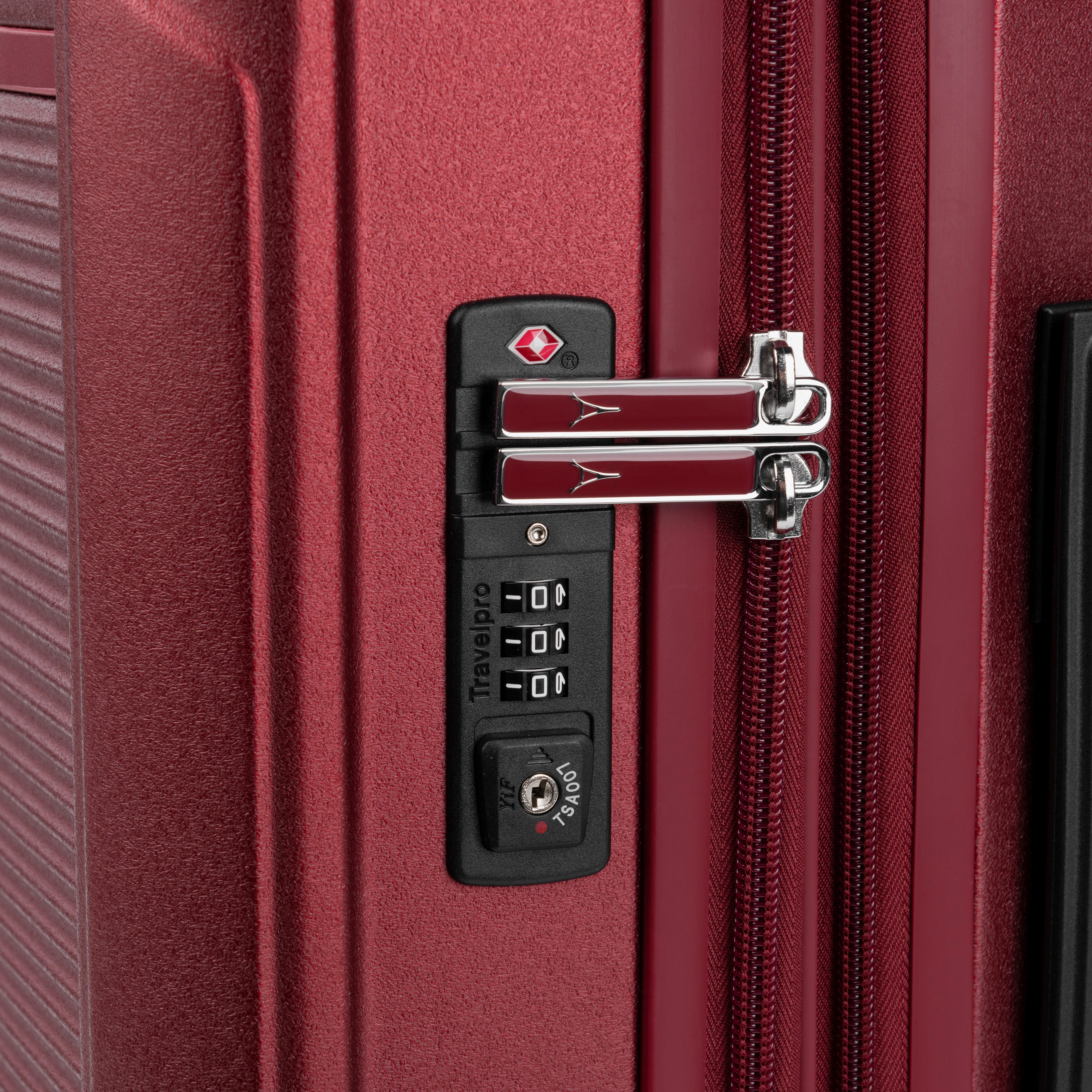 Close-up of a red suitcase's combination lock.