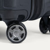 Close-up of a suitcase wheel with travelpro logo on a white background