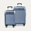 Two blue suitcases with a textured surface on a white background