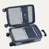 Open gray suitcase with black wheels on a white background