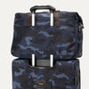 Platinum® Elite UnderSeat Tote in Camouflage secured on top of matching luggage with a rear stacking strap over the telescoping handle.
