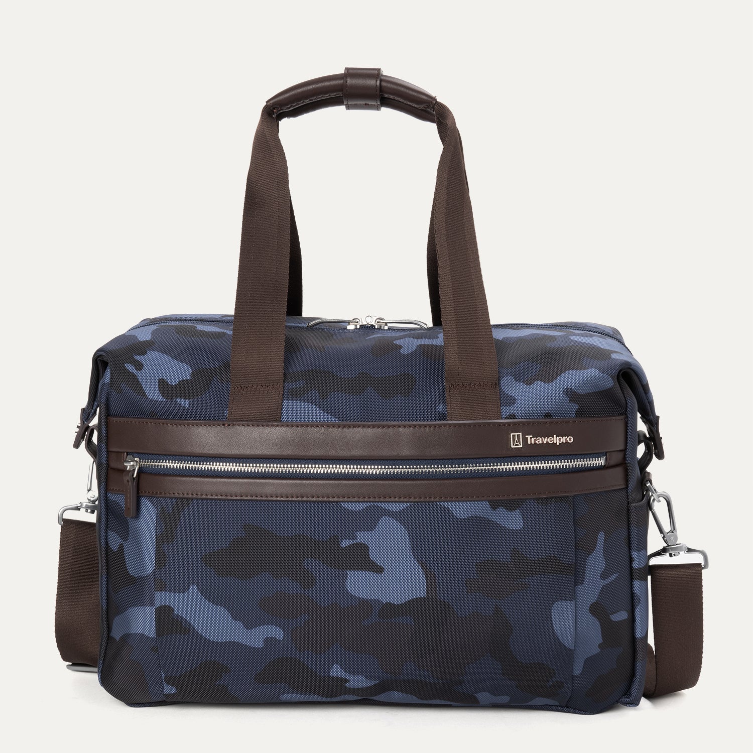 A camouflage-patterned underseat tote bag with full-grain leather details and a Travelpro logo, featuring a brown leather handle and shoulder strap, and a front zipper pocket.