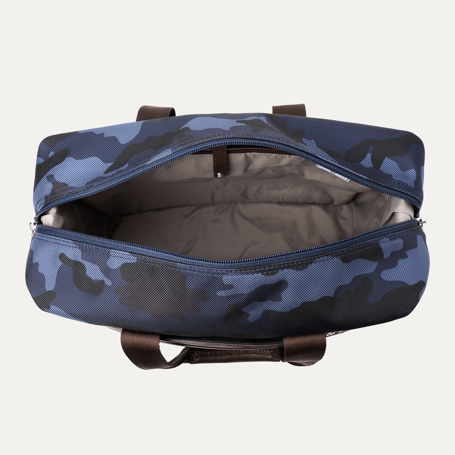 Open camouflage travel tote showing a spacious, light-colored interior.
Ask ChatGPT