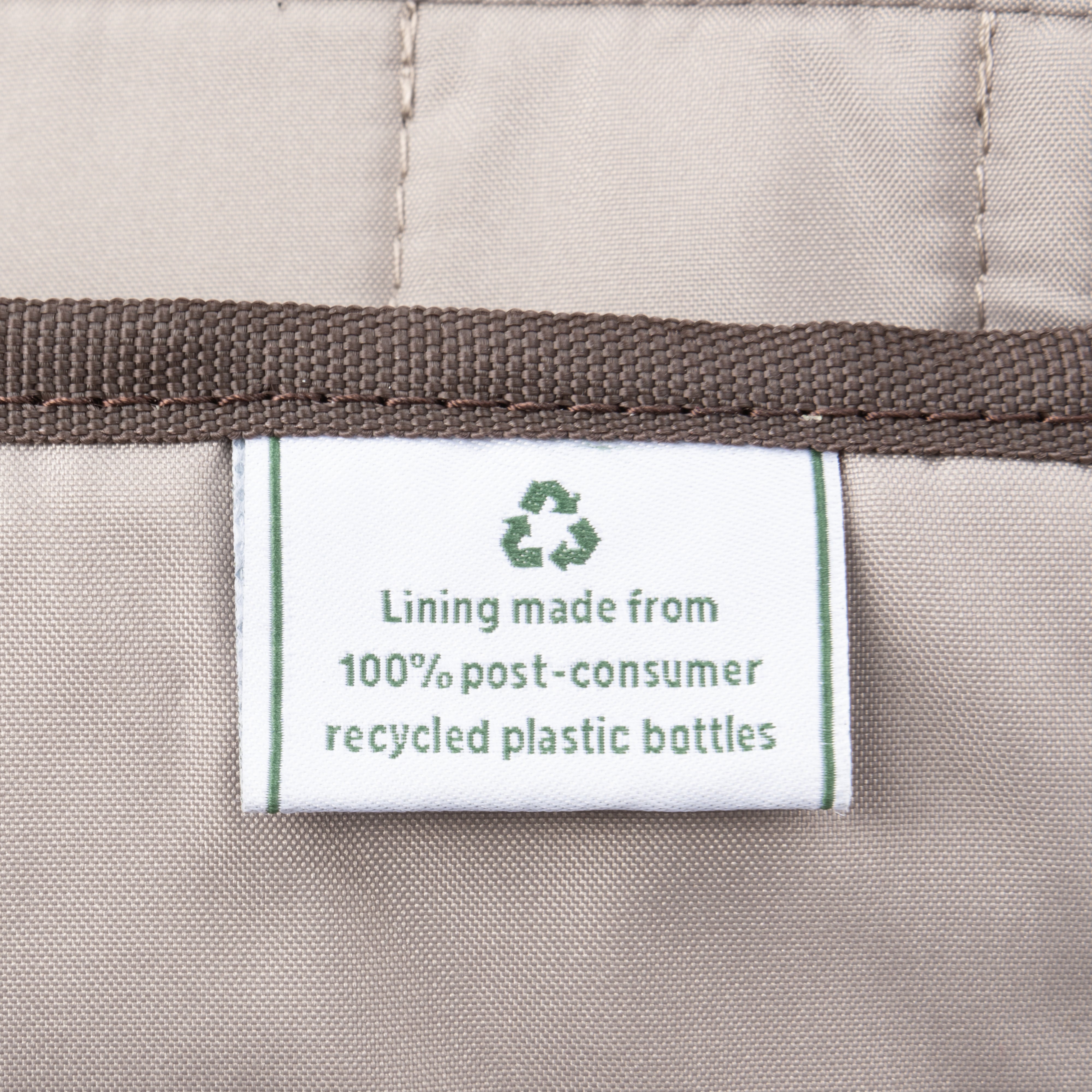 Close-up of label indicating lining made from 100% post-consumer recycled plastic bottles.