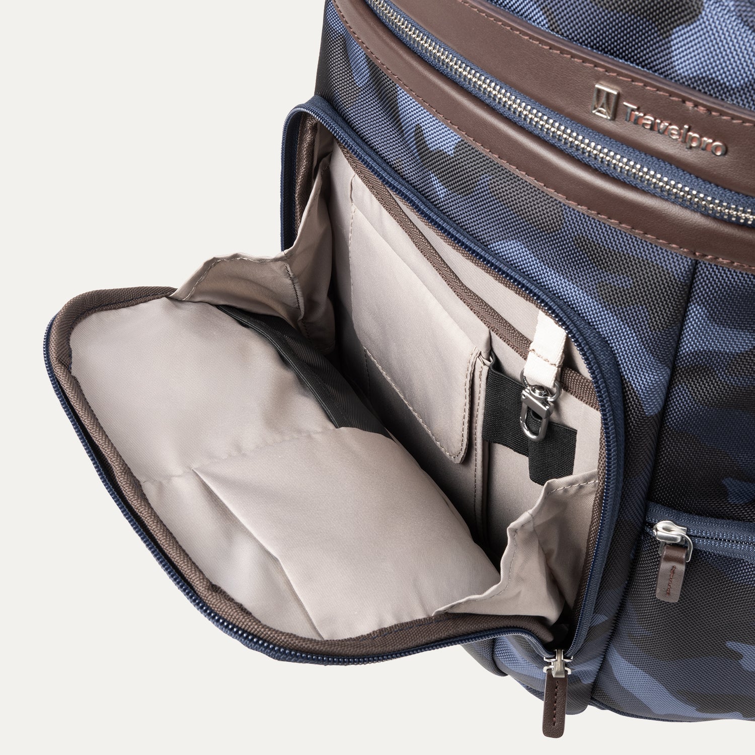 Platinum® Elite Business Backpack in blue camouflage, showing the front compartment unzipped to reveal organized interior pockets for accessories, pens, and small electronics.