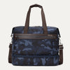 Front view of Travelpro Platinum Elite Drop-Bottom Weekender in Navy Camouflage with dual carry handles and zippered front pocket.
