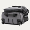 bottom view of the Travelpro® BOLD™ by Travelpro® carry-on in Gray Black, showcasing its sturdy inline wheels, reinforced bottom handle, and rugged protective base