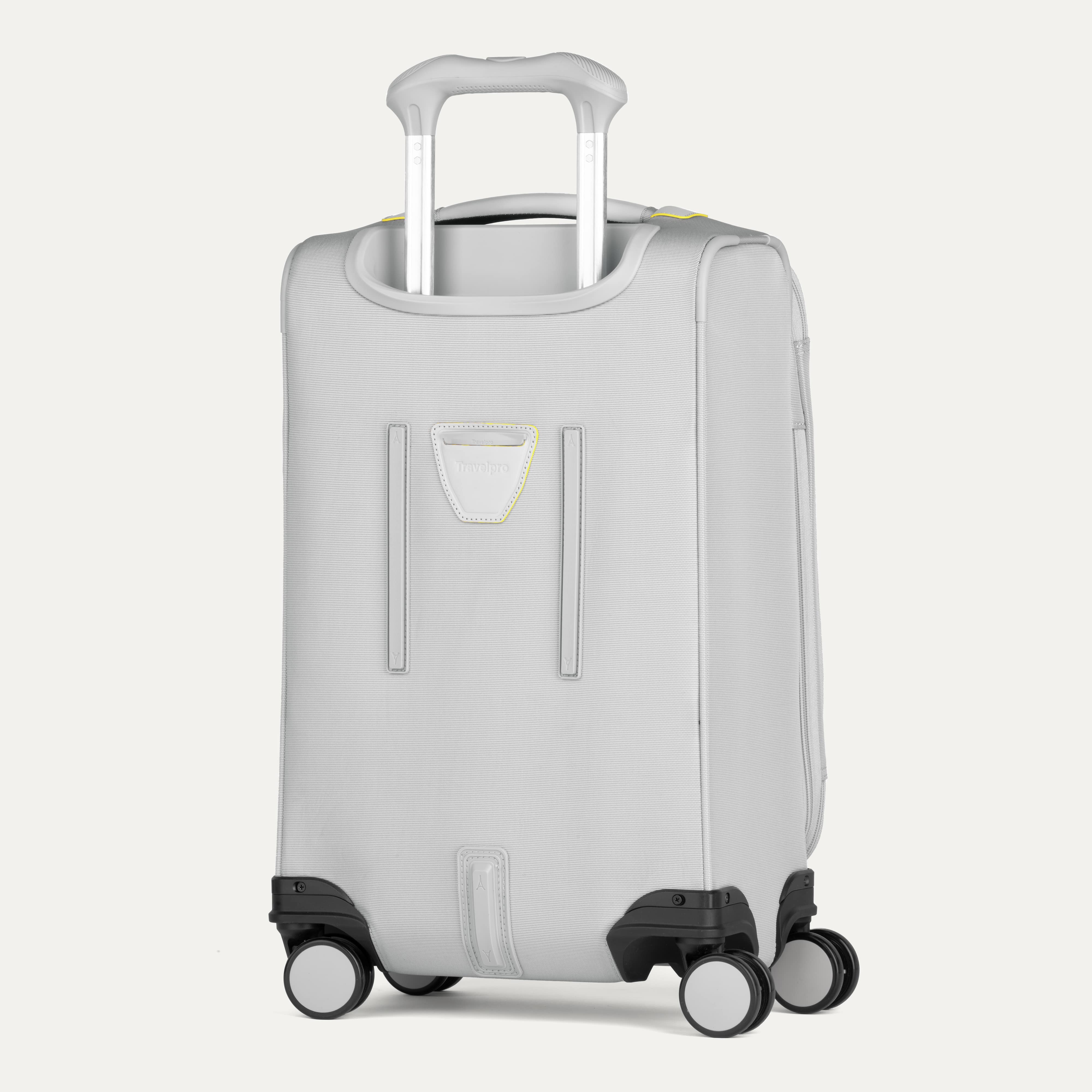 Light gray suitcase with wheels and handle on a white background