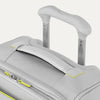 Gray suitcase with a handle and yellow accents on a white background