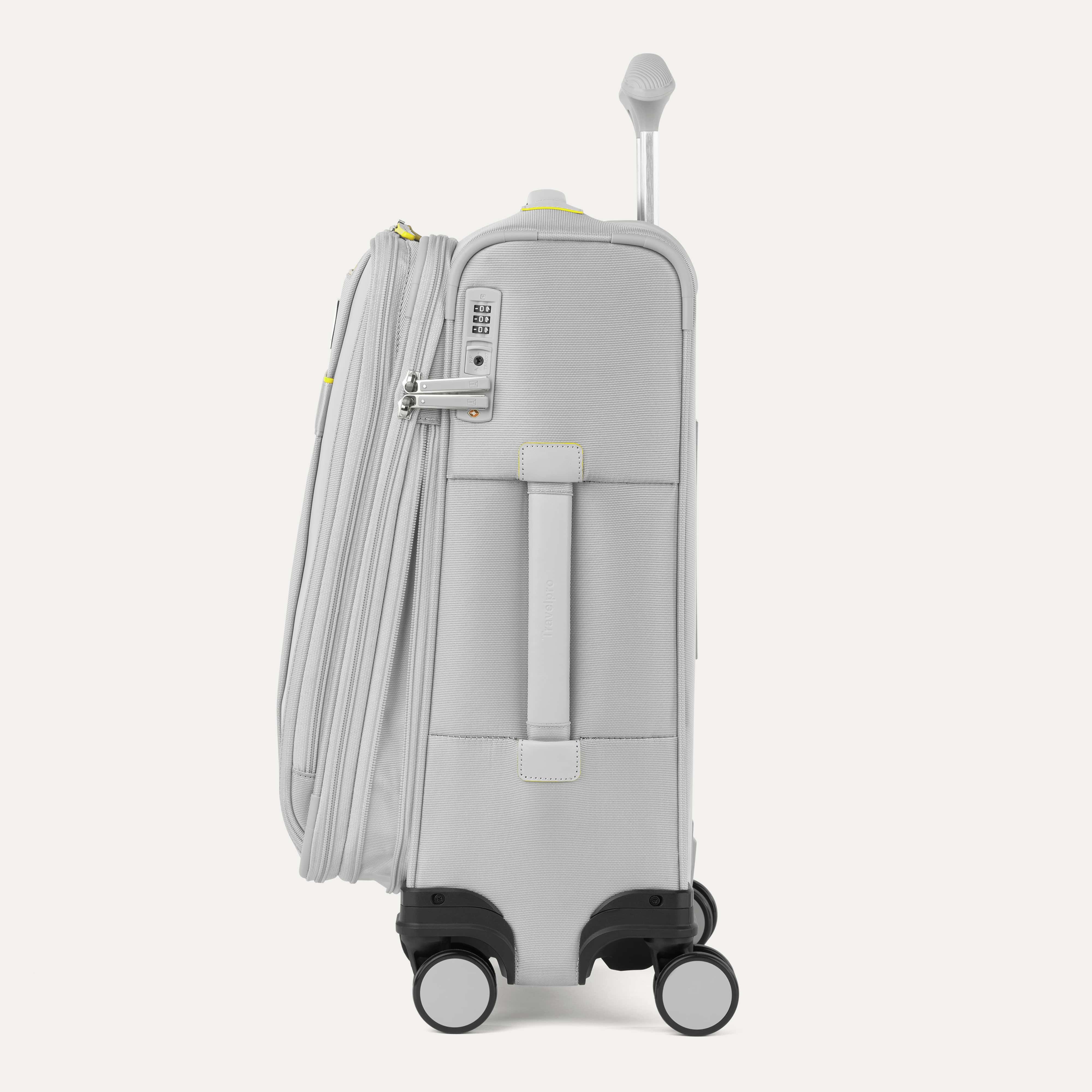 Light gray suitcase with wheels and handle on a white background