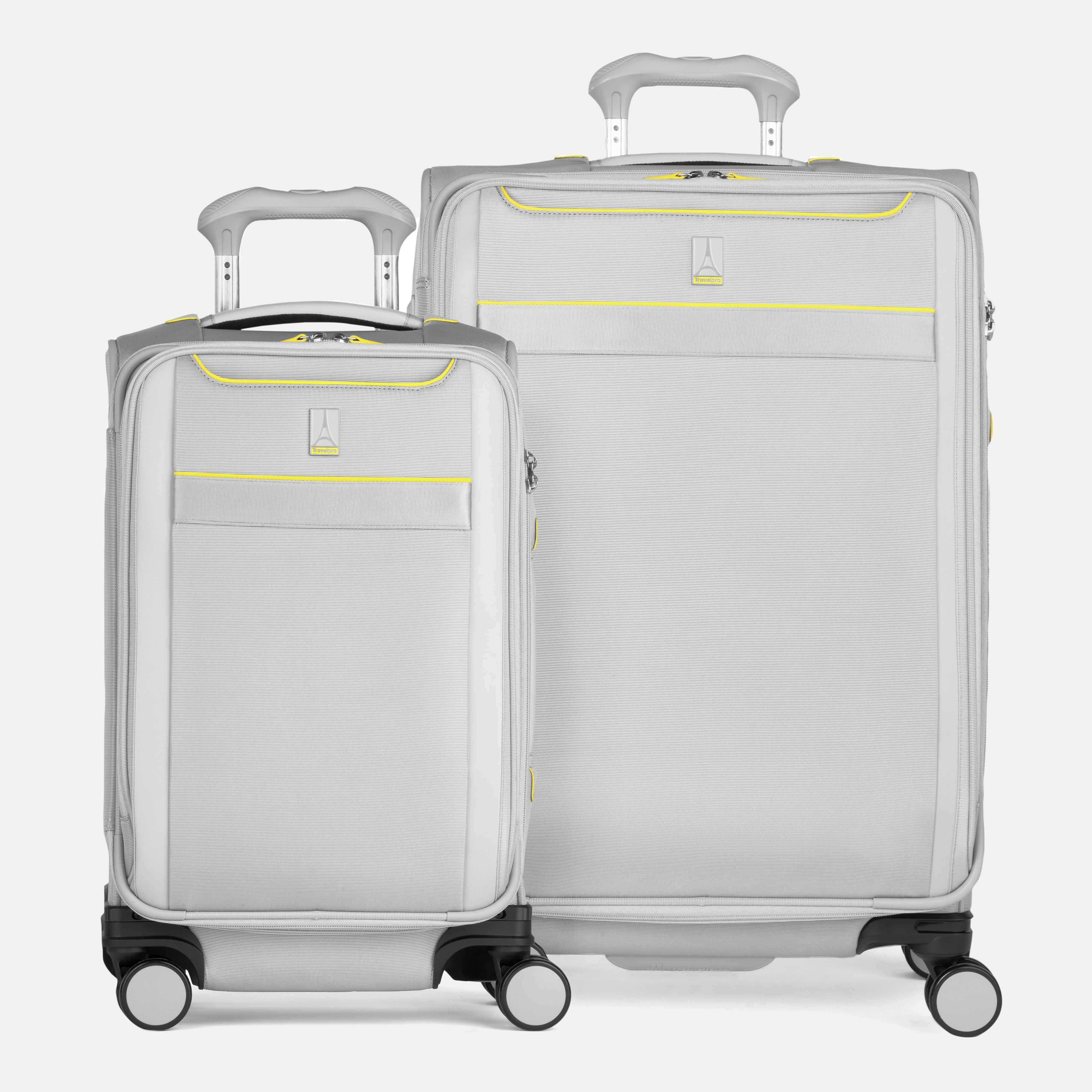 Two gray suitcases with yellow accents on a white background