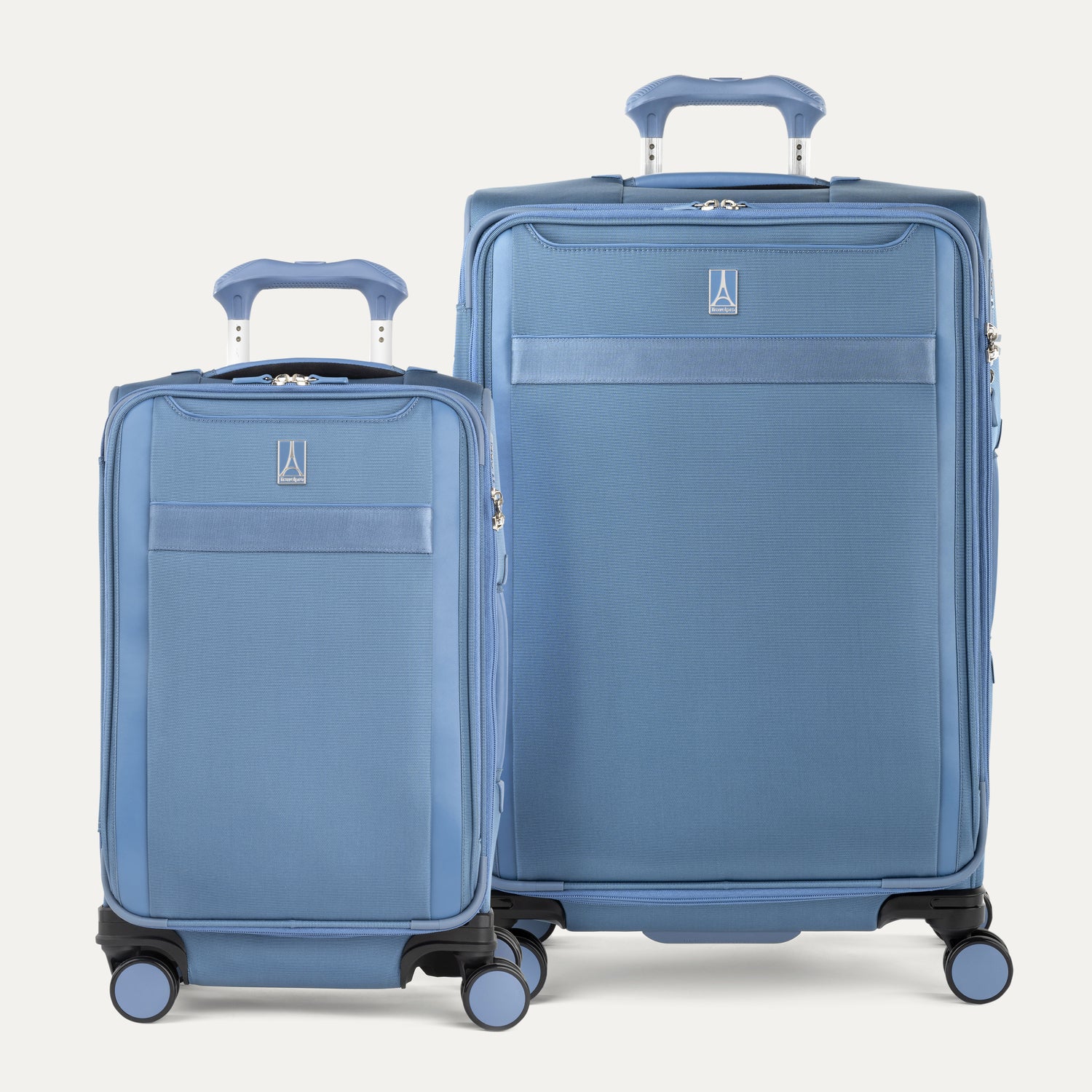 Two blue suitcases of different sizes on a white background