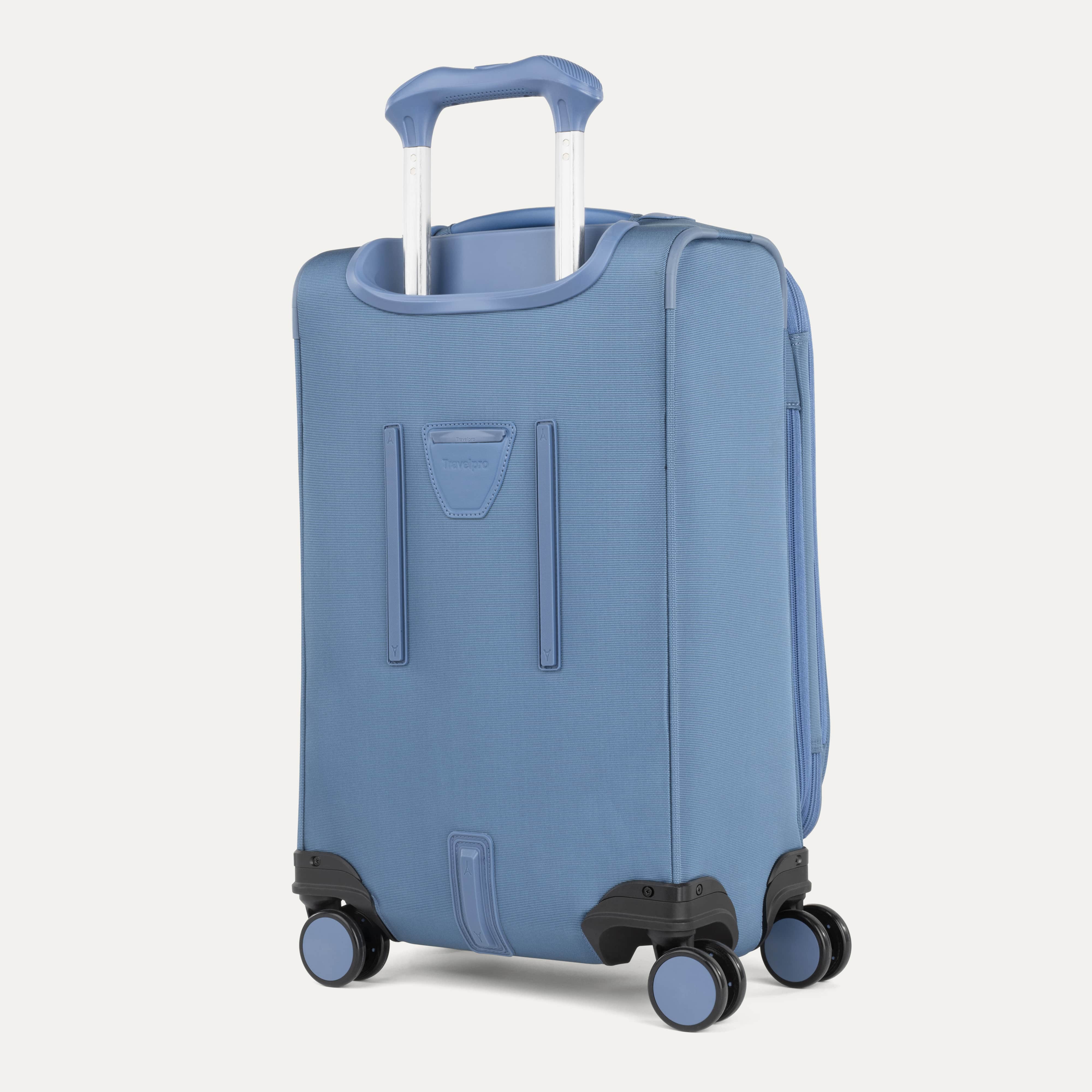 Blue suitcase with wheels and handle on a white background