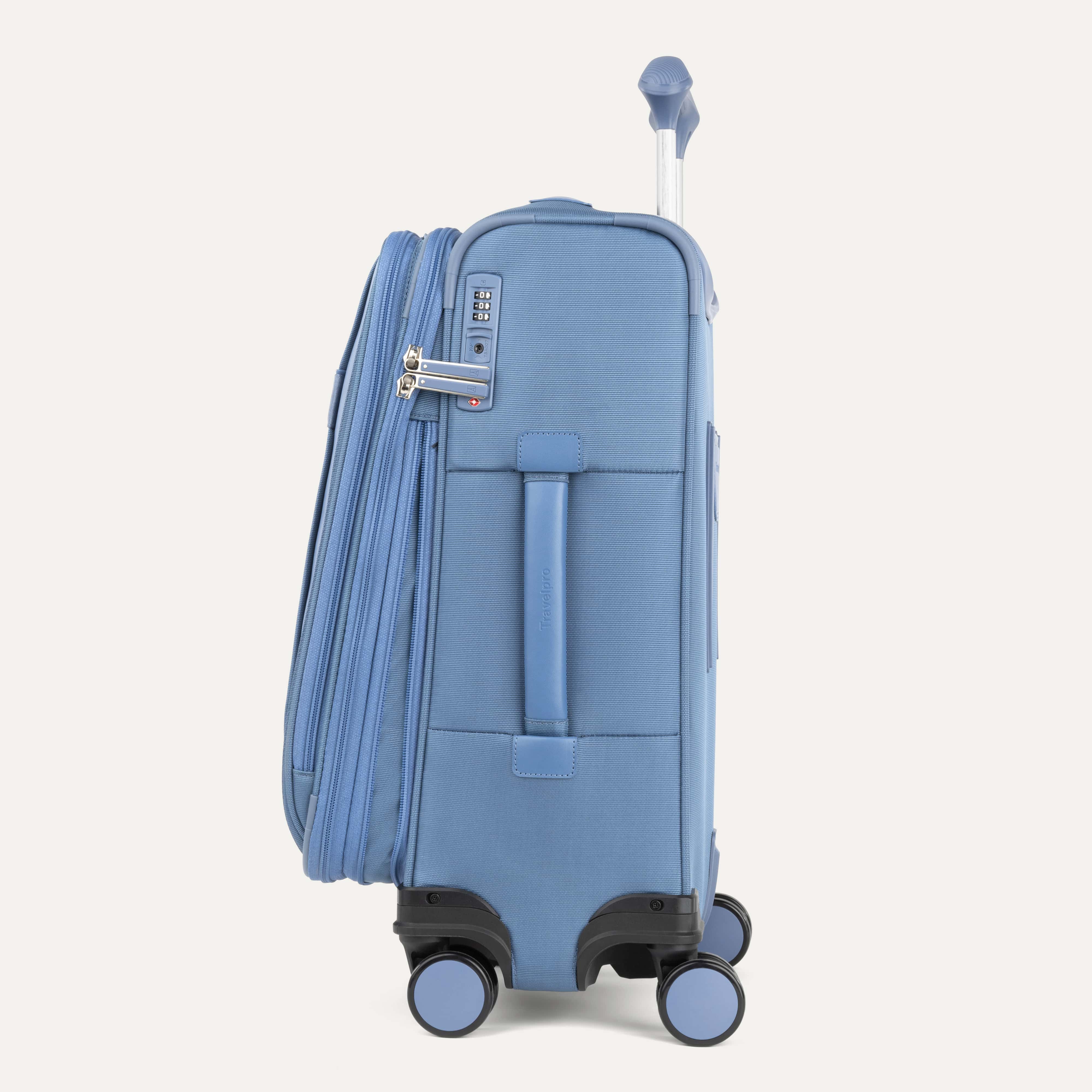 Blue suitcase with wheels and handle on a white background