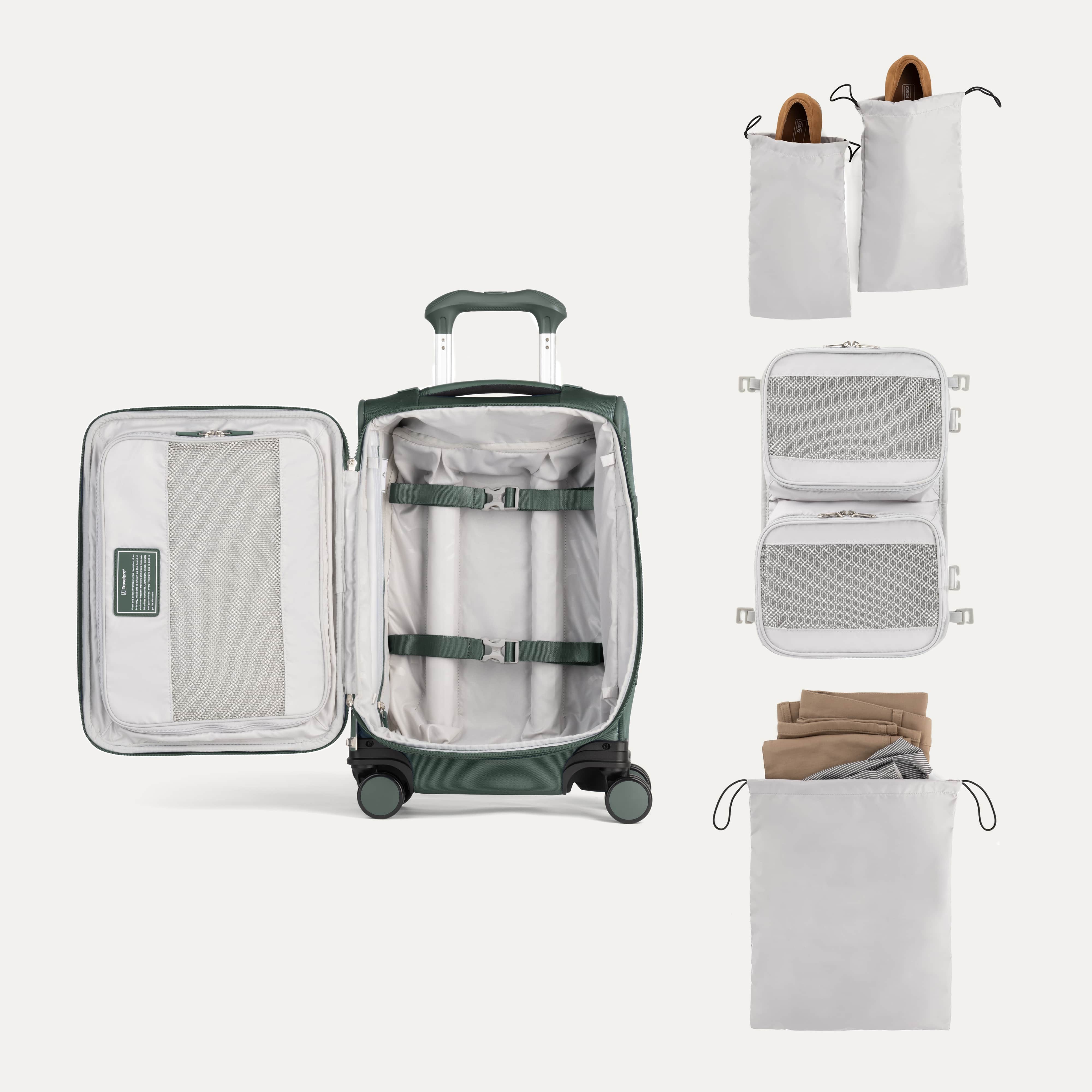Open suitcase with packing accessories on a white background