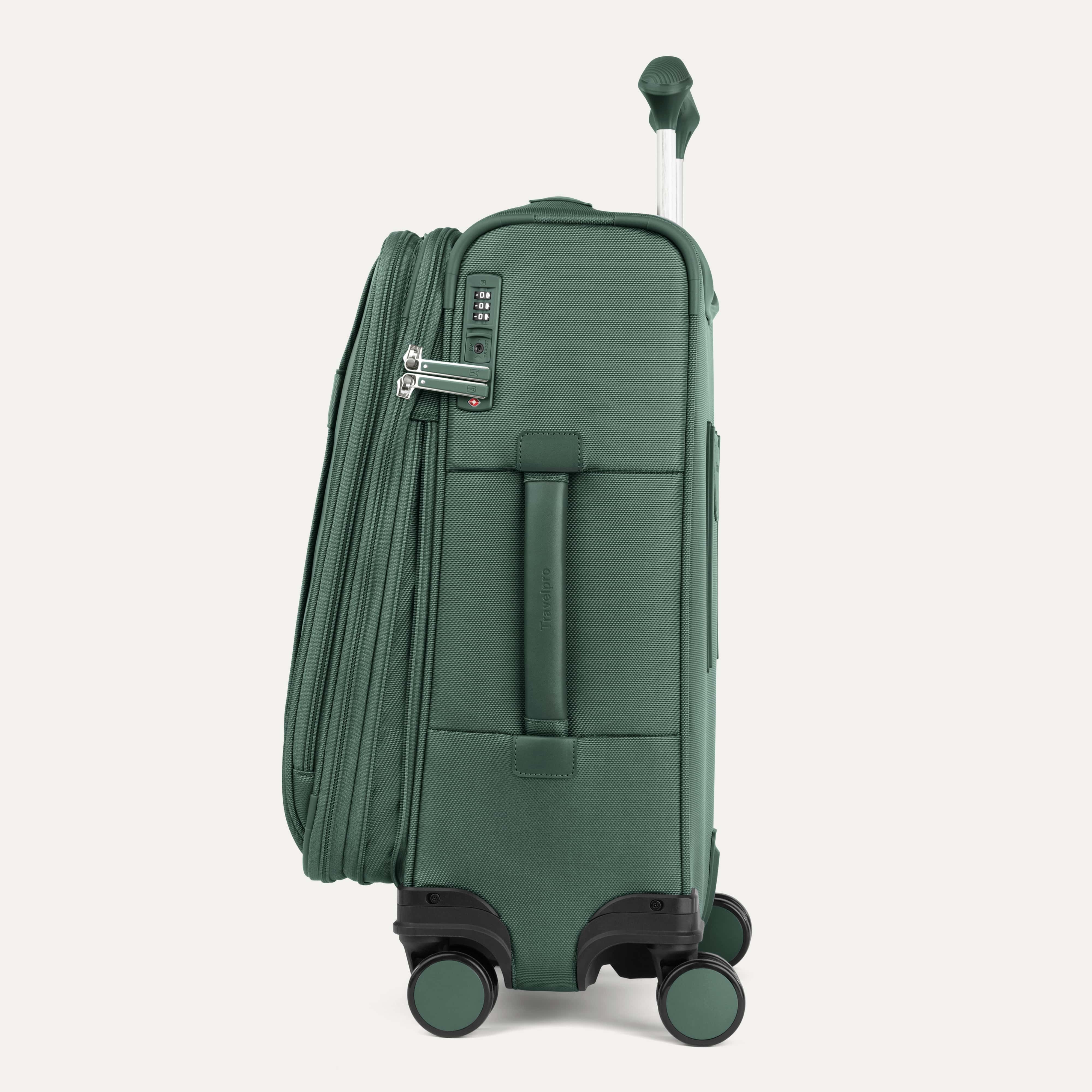 Green suitcase with wheels on a white background