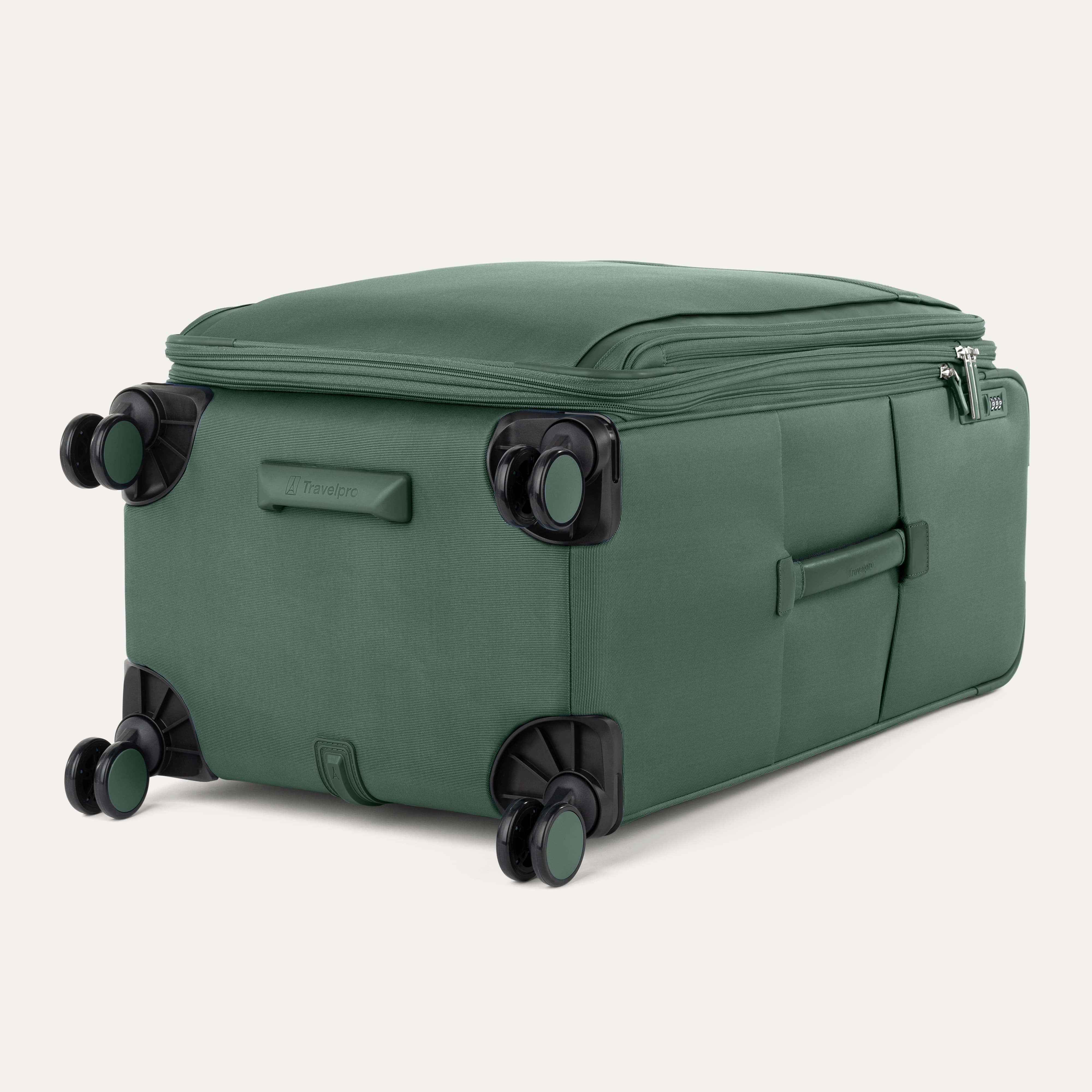 Green suitcase with black wheels on a white background
