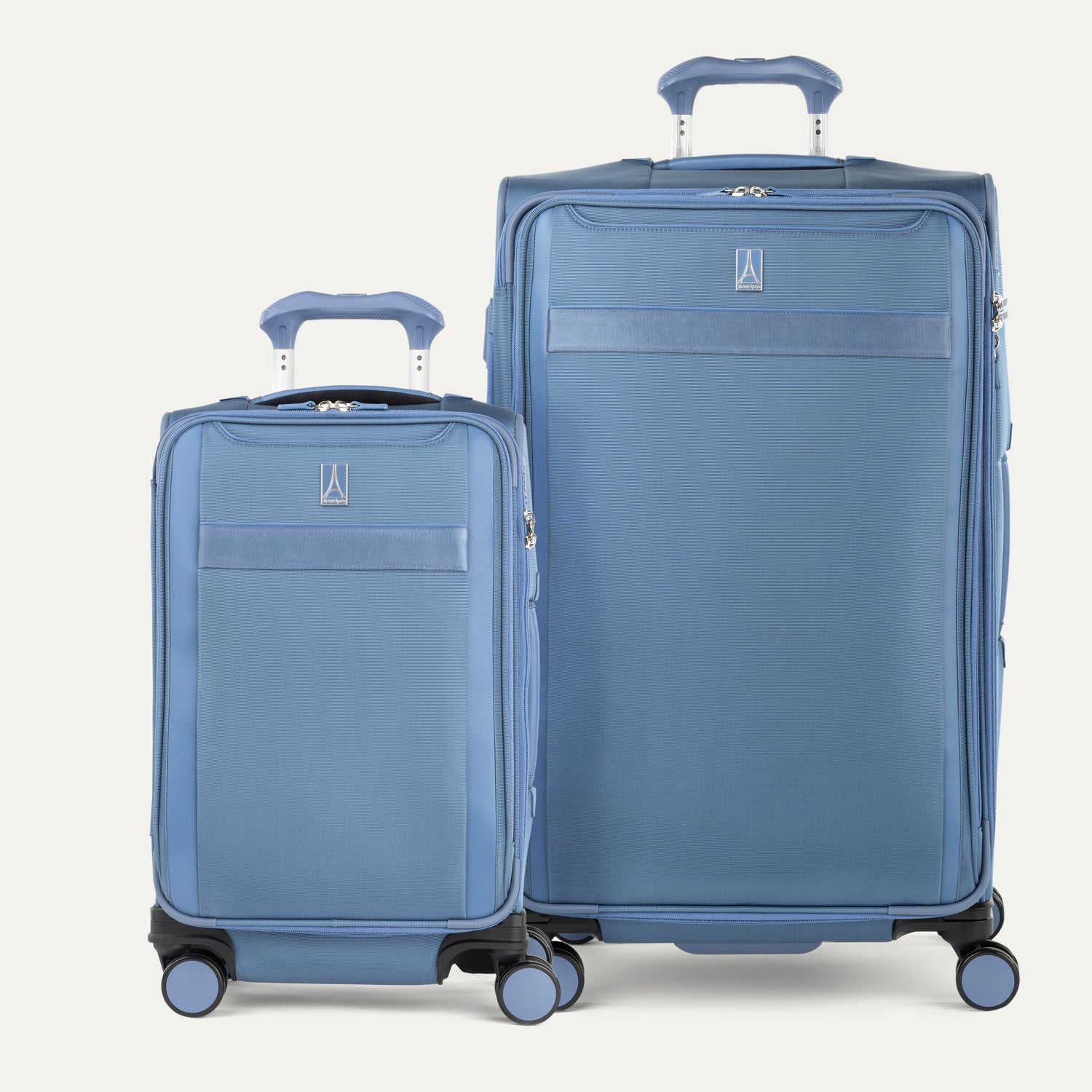 Two blue suitcases of different sizes on a white background