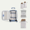 Open suitcase with travel packing cubes and clothes on a white background