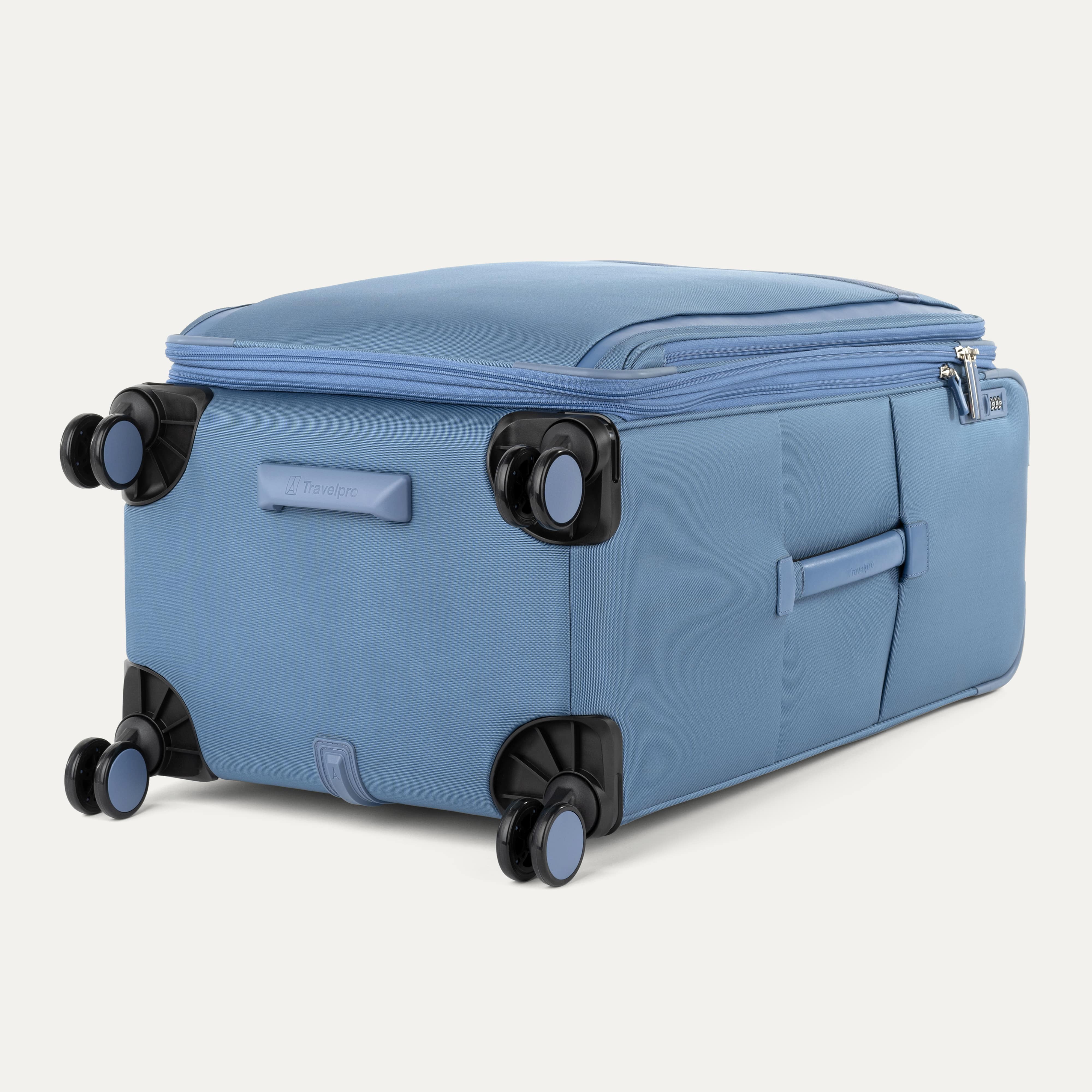 Blue suitcase with black wheels on a white background